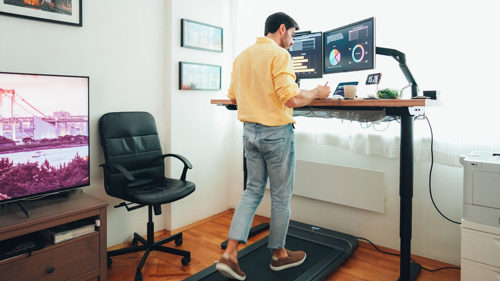 man using a standing desk
