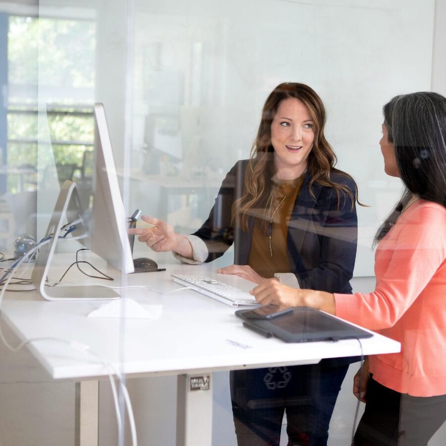 women in front of standing desk
